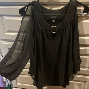 Asymmetrical top with a sheer top layer and a fitted part underneath.